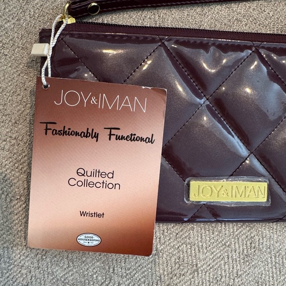 NWT - Joy and Iman Quilted Collection Wristlet
Burgundy - Picture 2 of 9